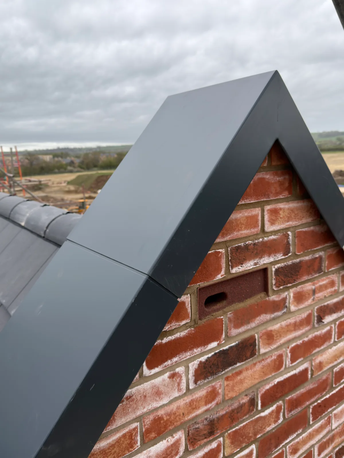 Metal flashing at a roofline in Swindon