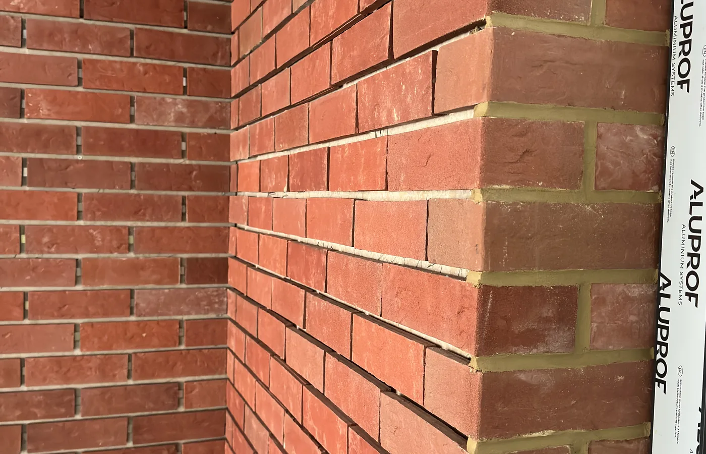 Brick slip interface installation detail and setting-out record.