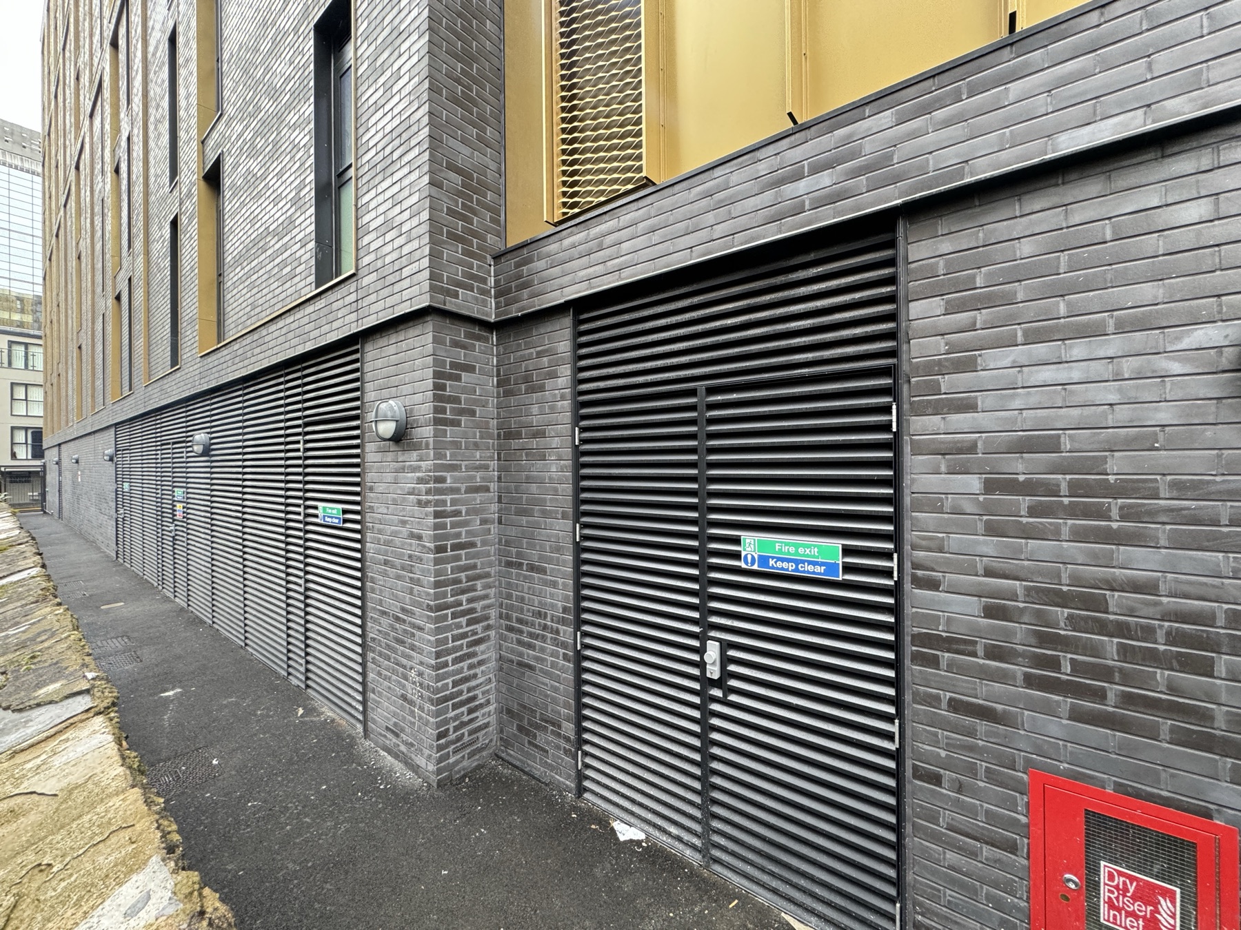 Cardiff CF10 brick slip facade installation and louvre interface for QA records