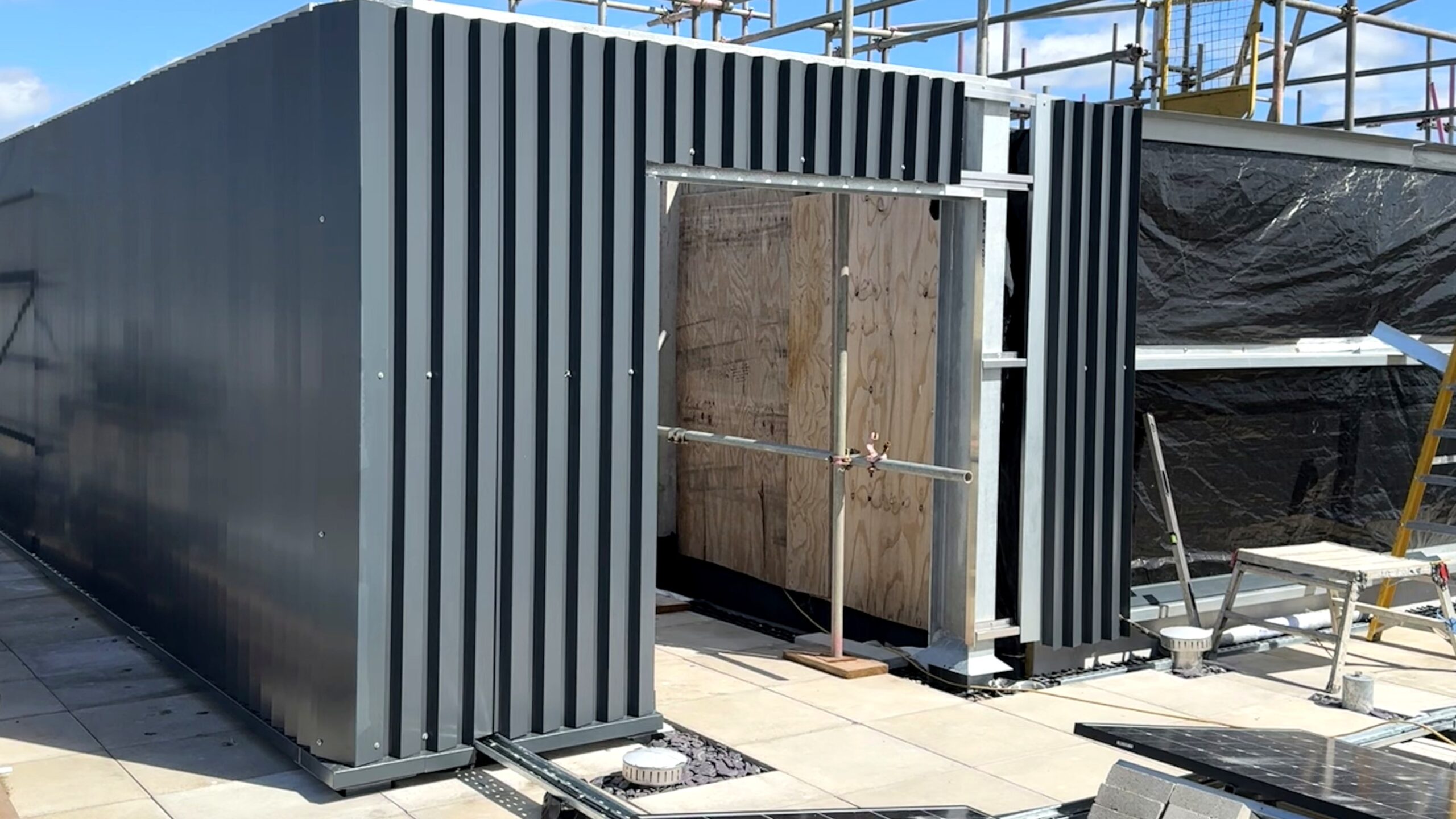 Clean BS1 metal cladding and rooftop envelope installation.