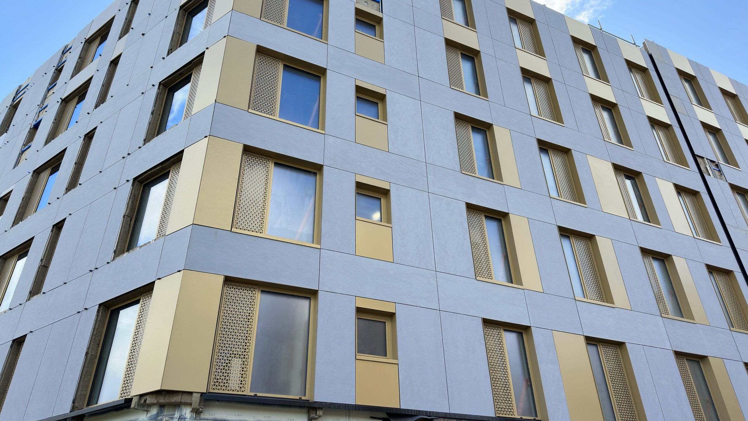 Wide UWE Bristol facade panel installation used as the Cladders.co.uk homepage hero image.