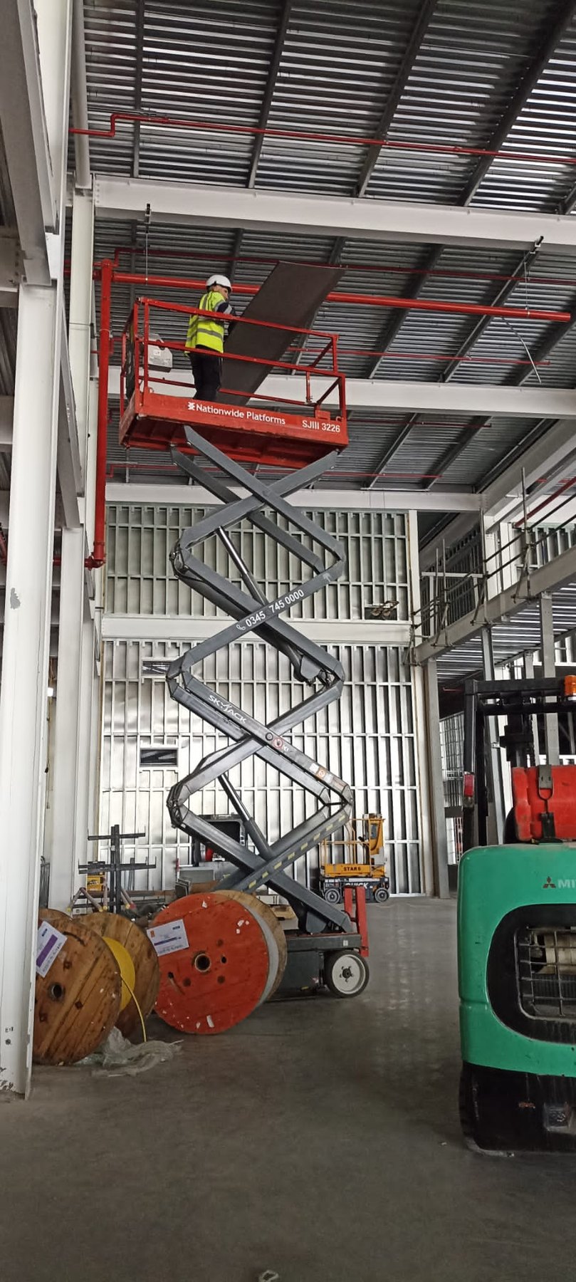 Internal cladding installation from a MEWP inside a data centre building