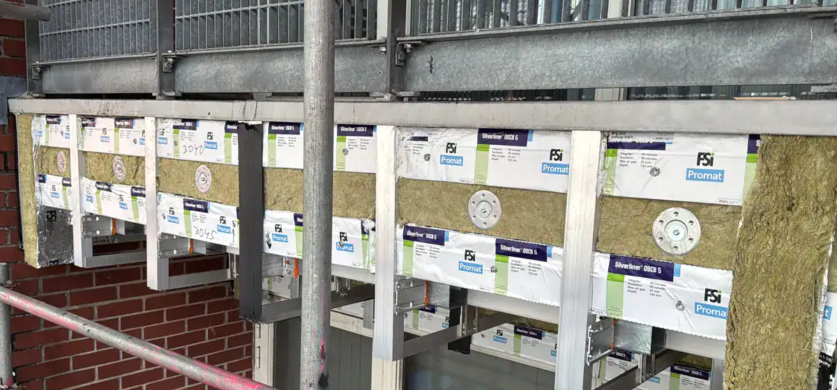 Fire barrier and cavity barrier interface detail during facade remediation works.