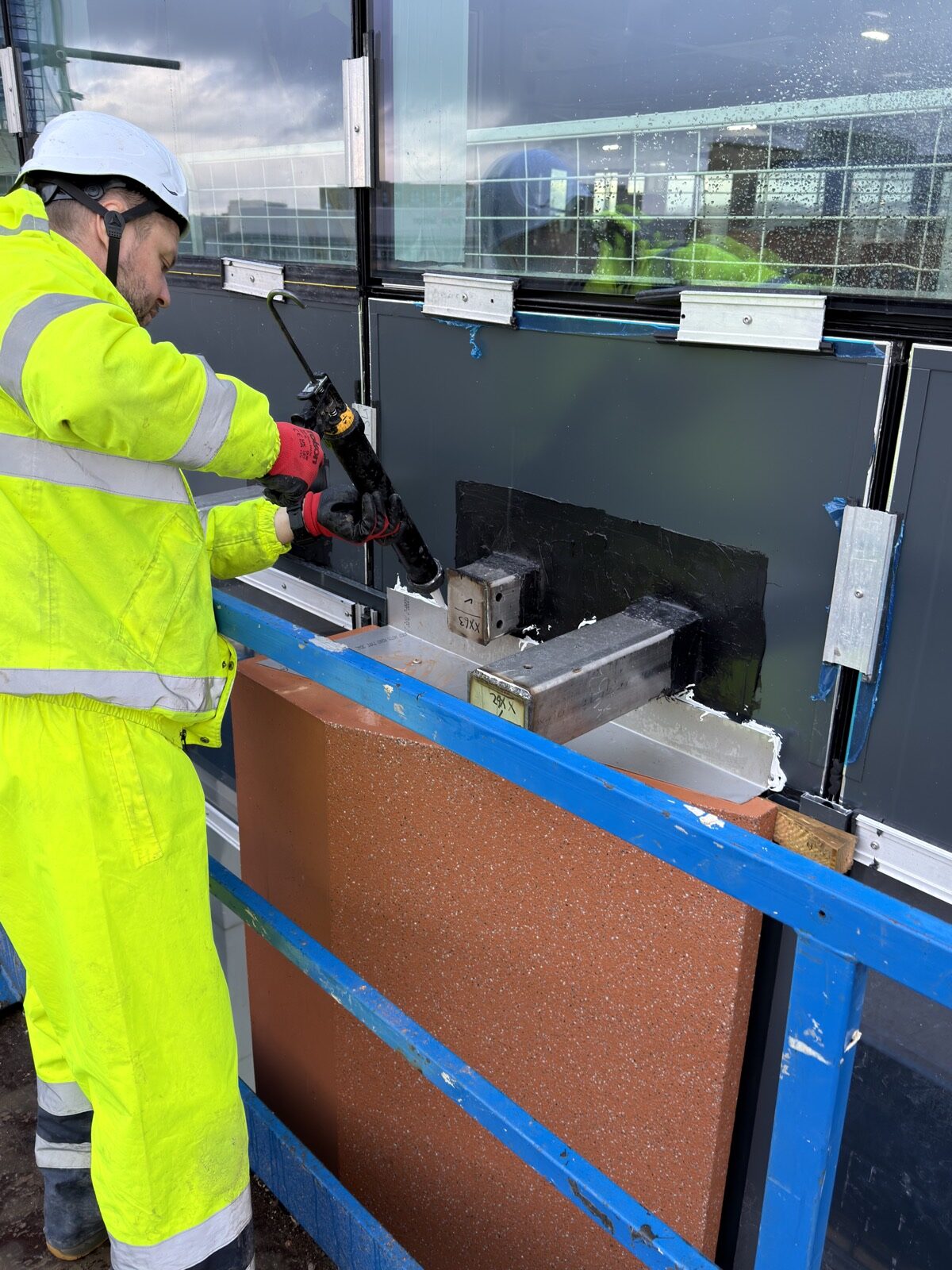 Sealant application around GRC facade bracket interface