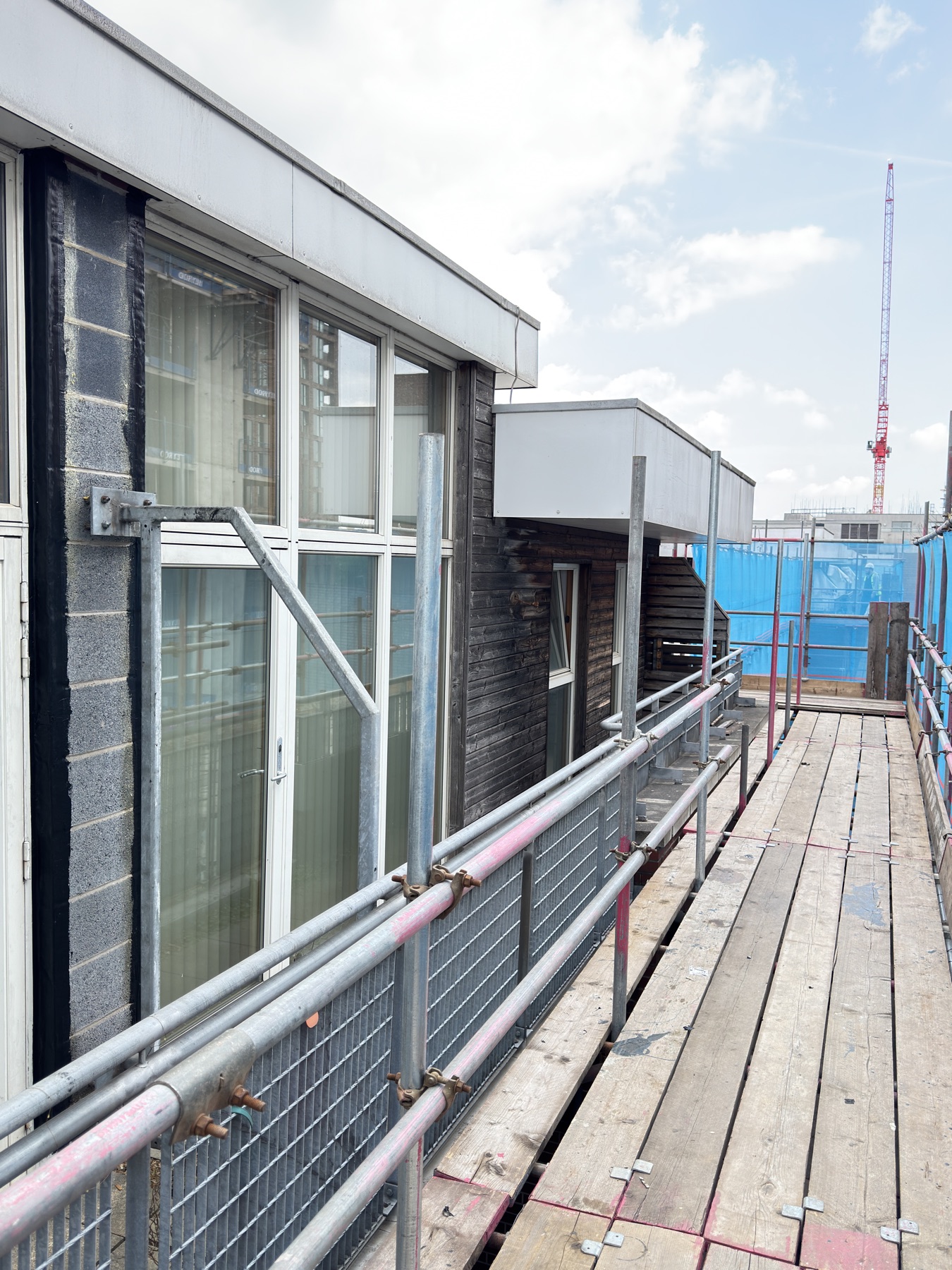 Recladding access context around an occupied residential building