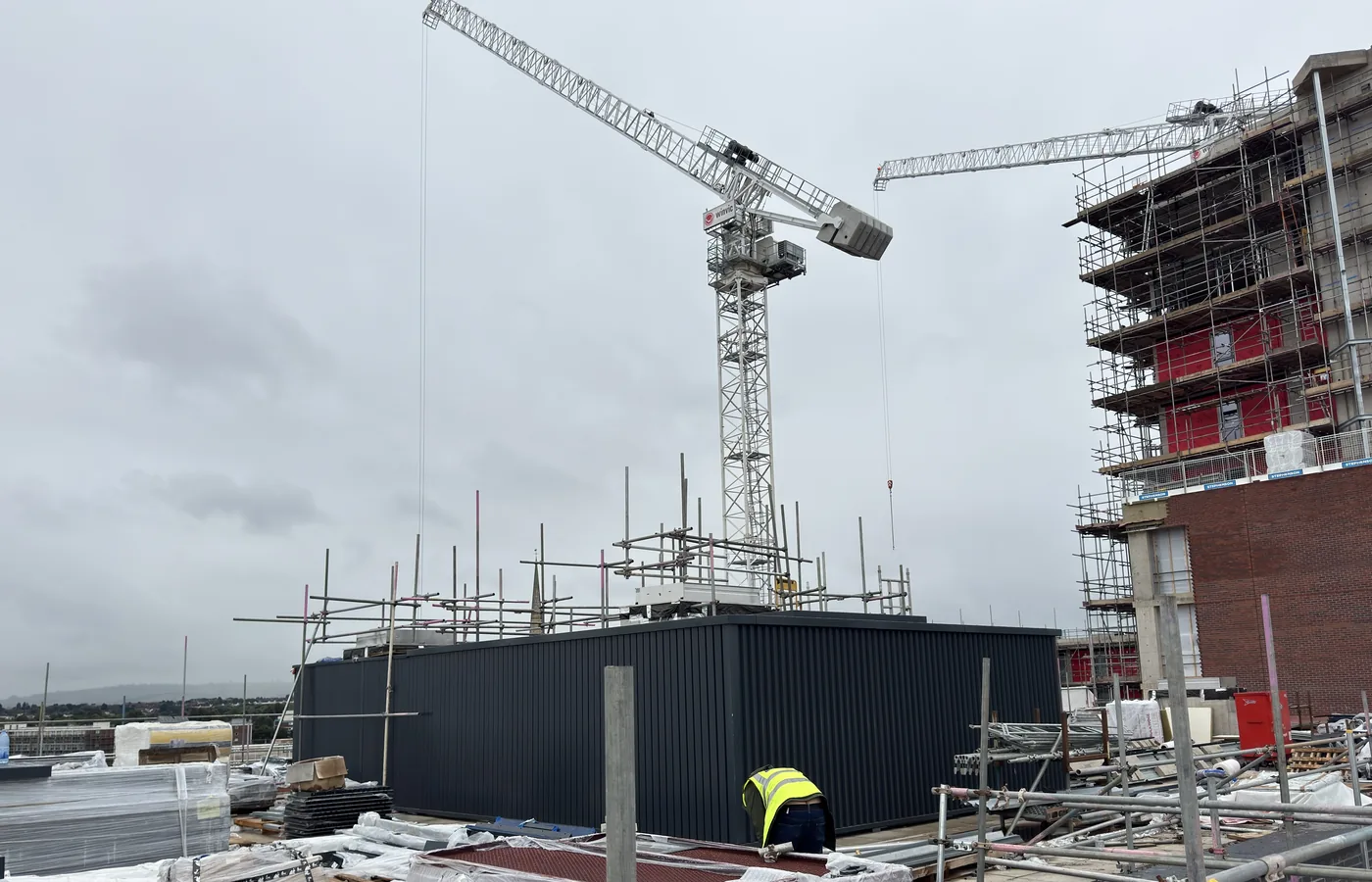 Rooftop cladding flashings and cappings installation on a commercial building.