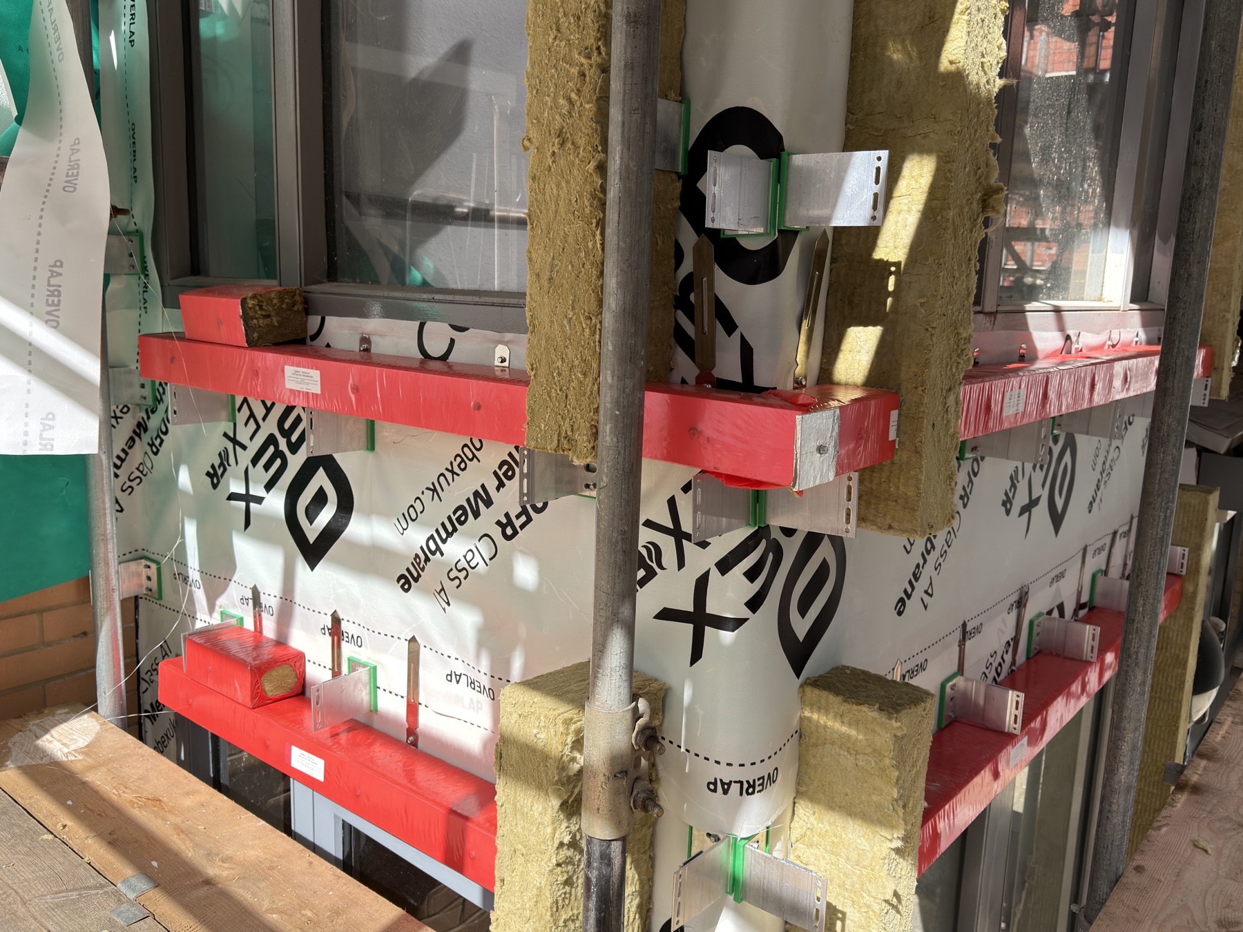 Cavity barrier interface installation around window openings at The Platform Bristol